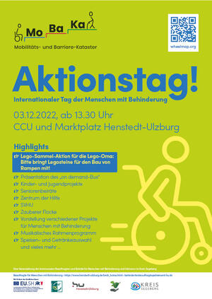 Ein grnes Plakat mit blauer Aufschrift der MoBaKa (Mobilitts- und Barriere-Kataster). In gelben Umrissen ist ein Rollstuhlfahrer gezeichnet.